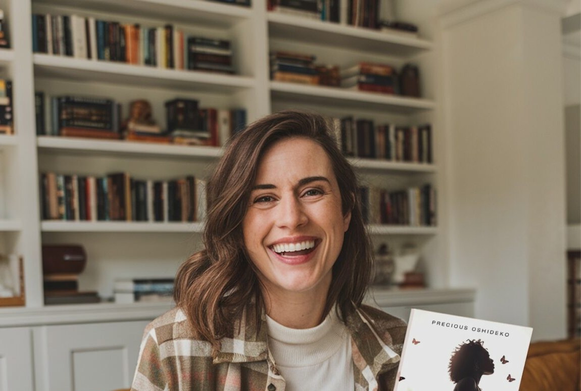 An author holding her finished, published book.